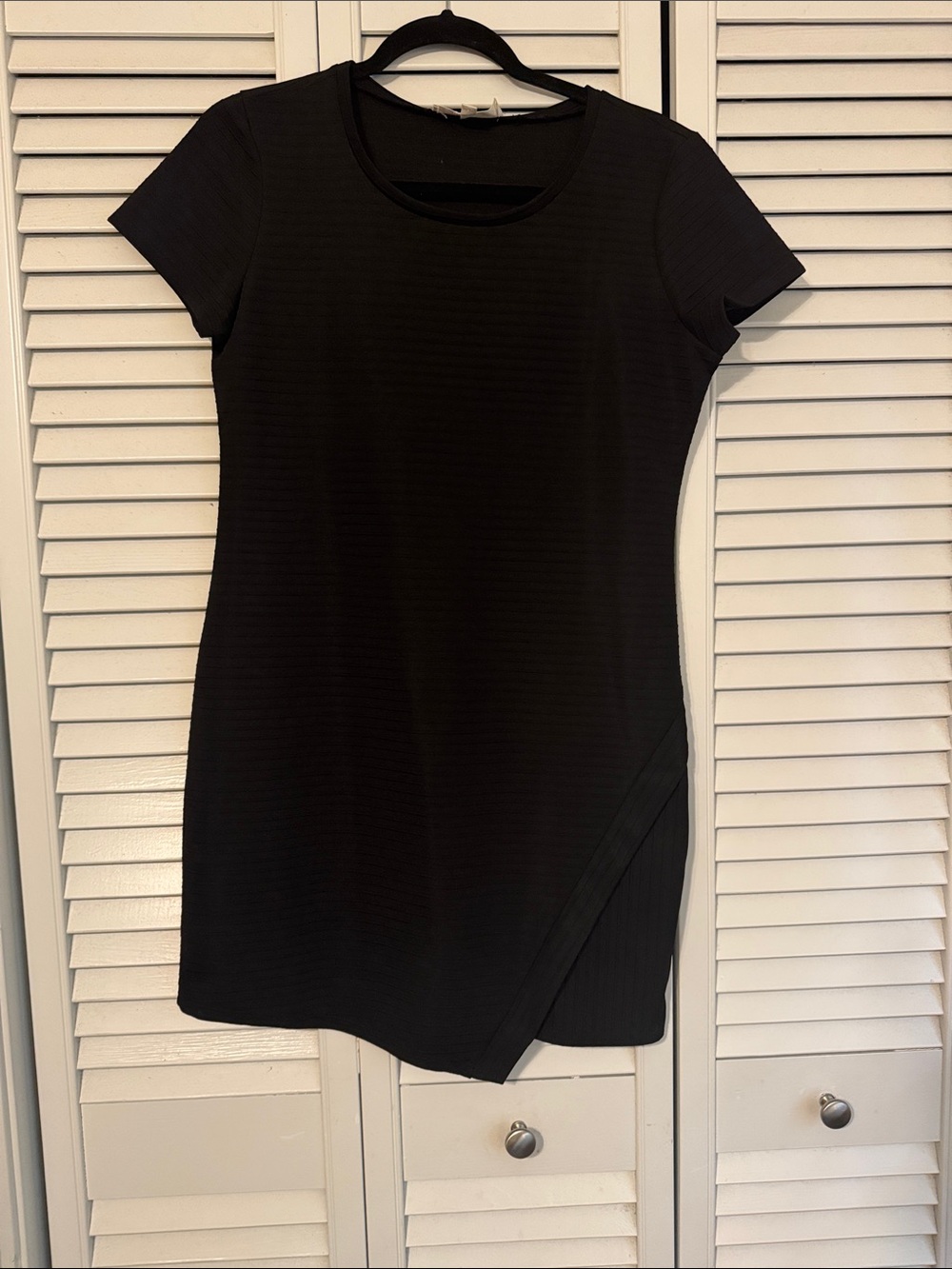 Modern Black Ribbed Mini Dress with Subtle Asymmetrical Hem